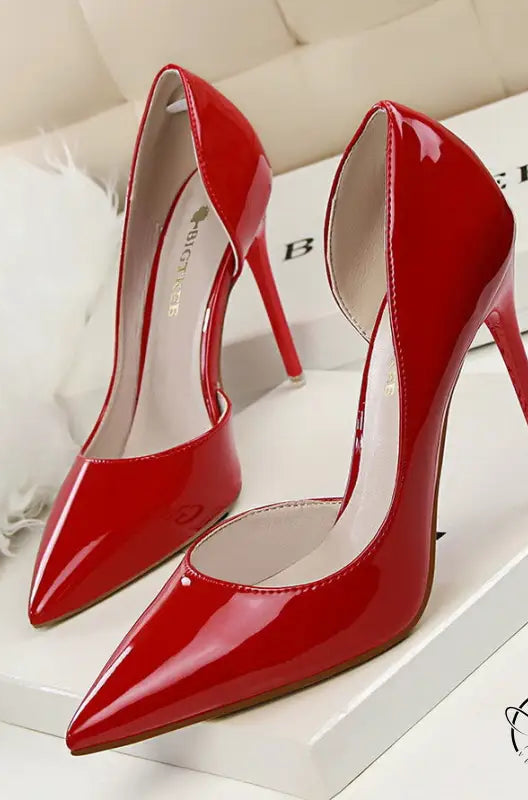 Glossy red patent leather low cut high heels with pointed toes