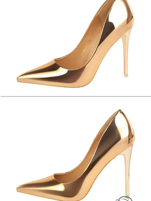 Elegant pair of gold stiletto heels in fashionable metal high heels style