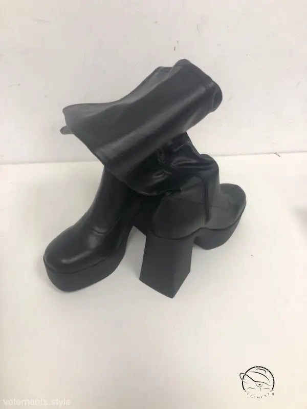 Classic black knee-high platform ankle boots with chunky heels