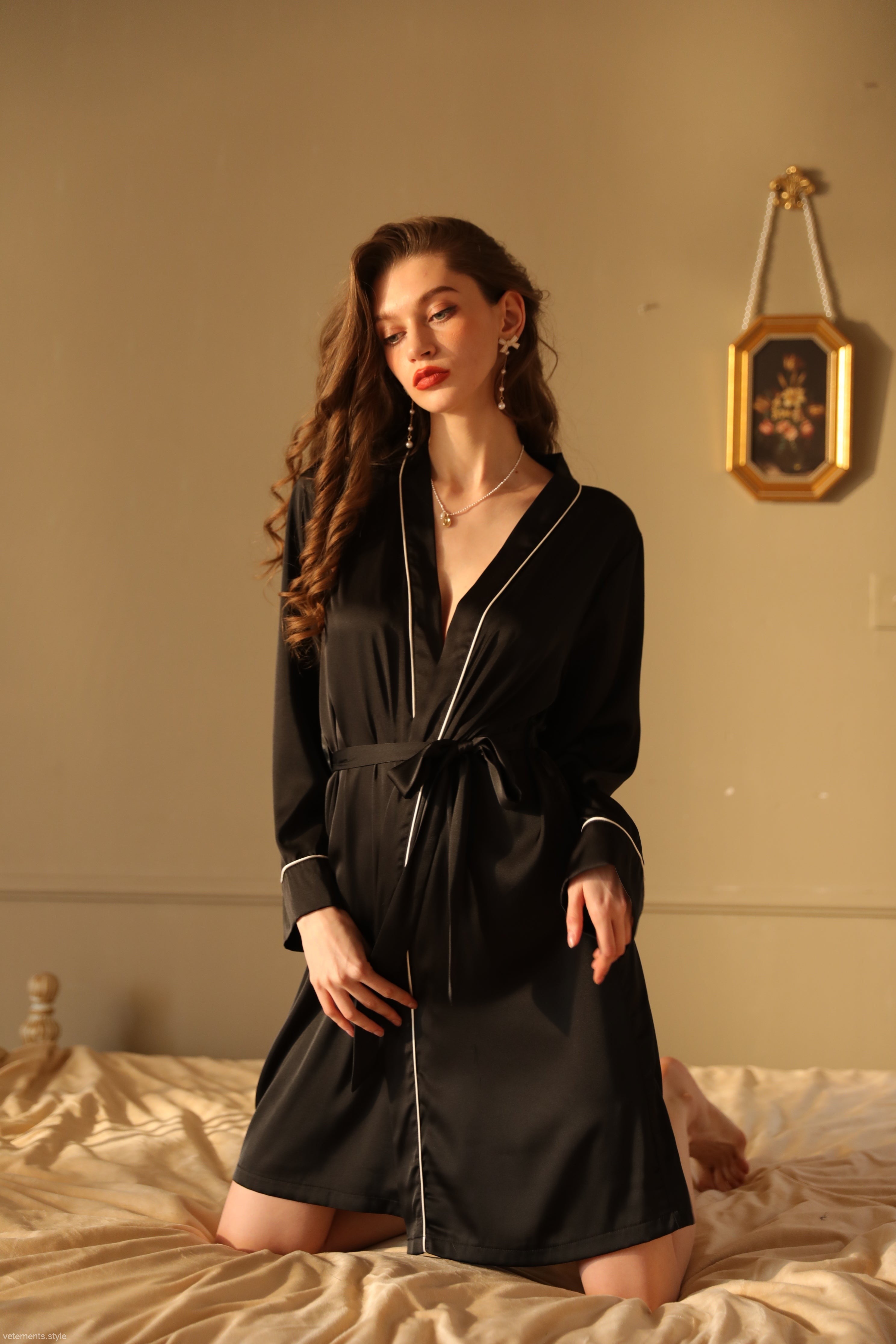 Elegant silk night-robe with black satin fabric and white piping, perfect for luxurious outerwear gown