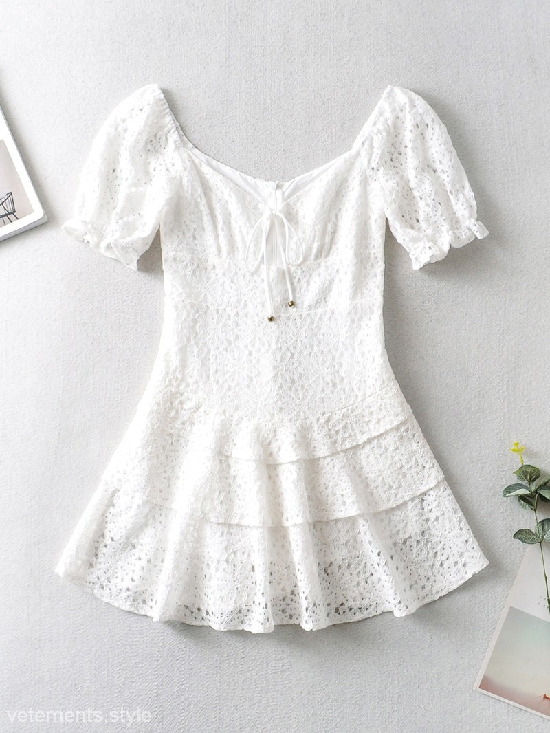 White eyelet tiered dress from the Elegant Short Lace Up Dress collection showed in image