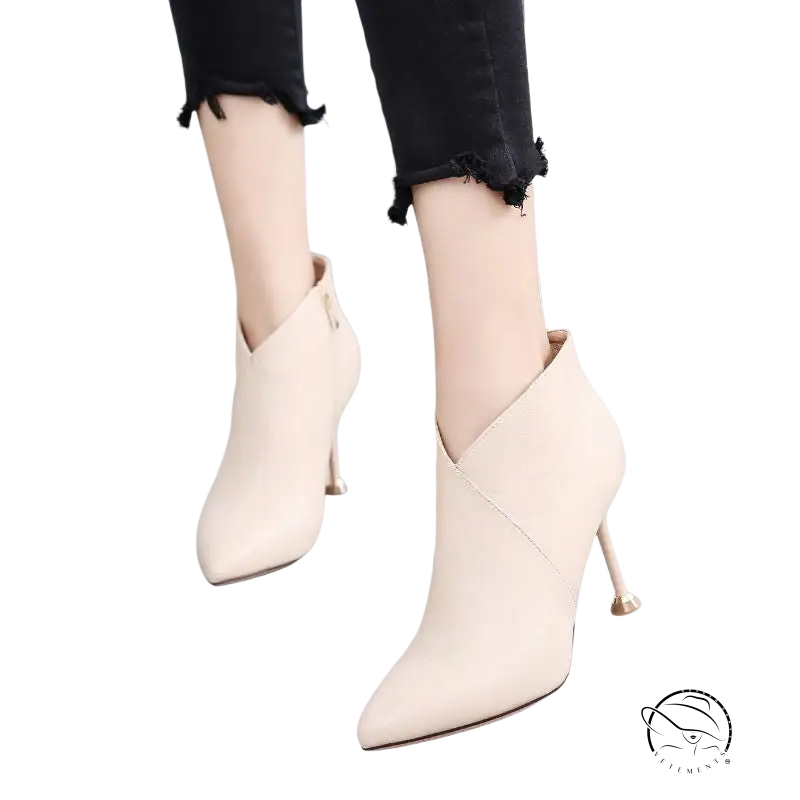 Cream-colored suede fashion European boots with pointed toe and high heel