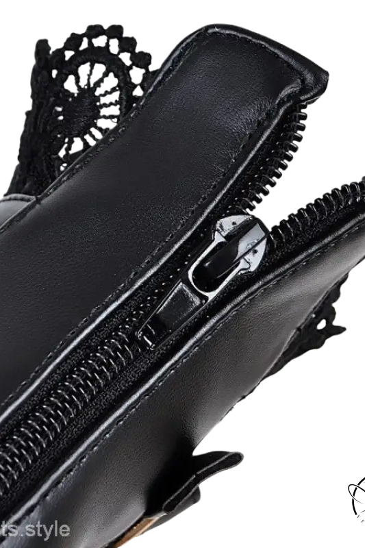 Black leather lace buckle boots with decorative zipper pull