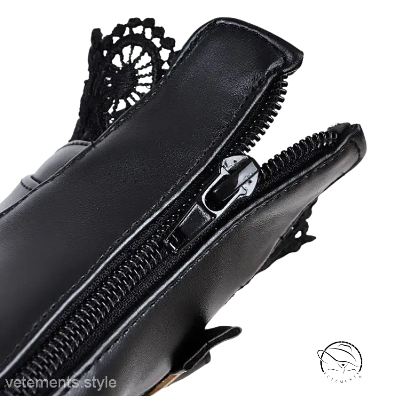 Black leather lace buckle boots with decorative zipper pull