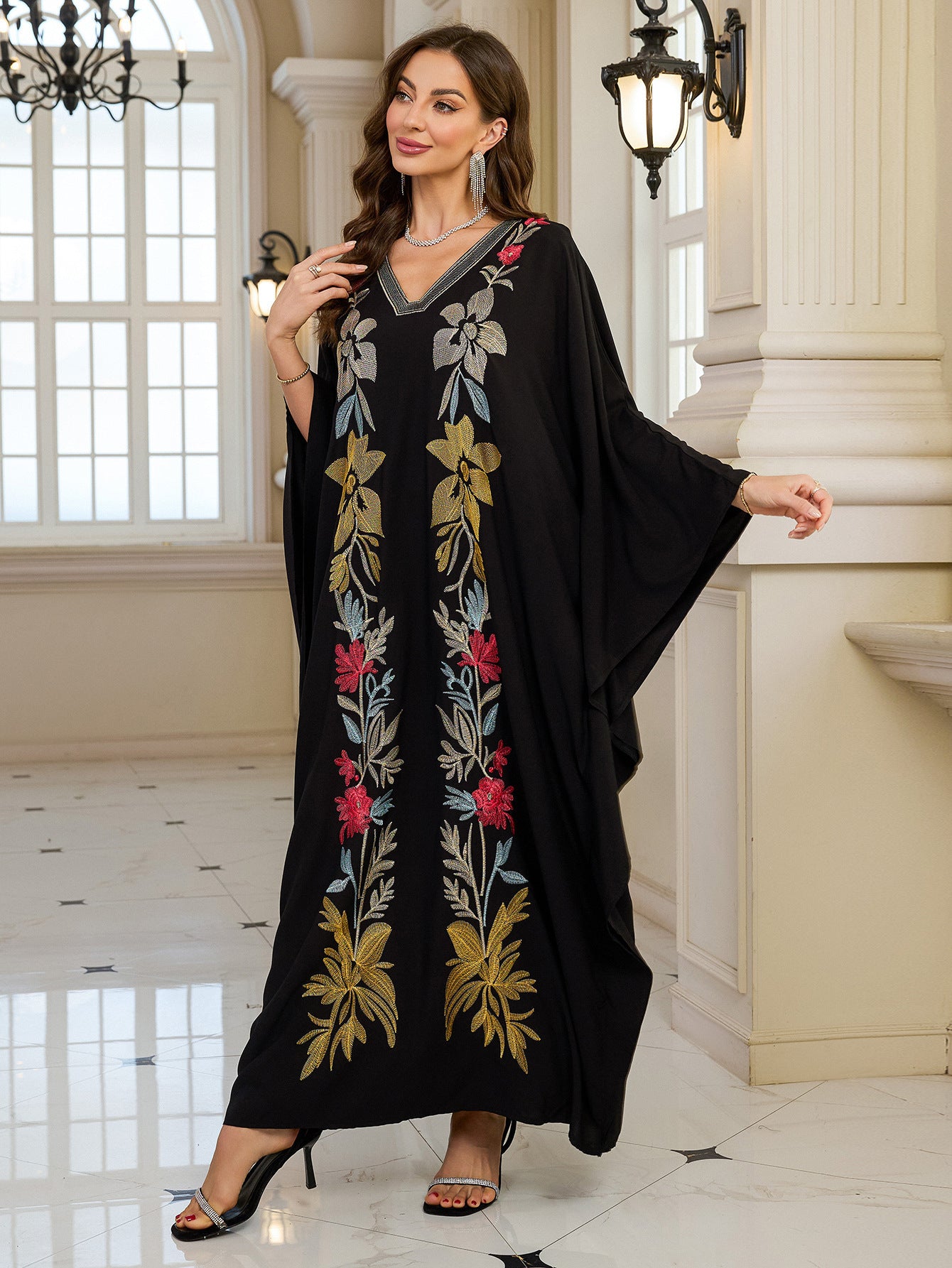 Elegant black floral embroidered kaftan dress with gold accents and high heels