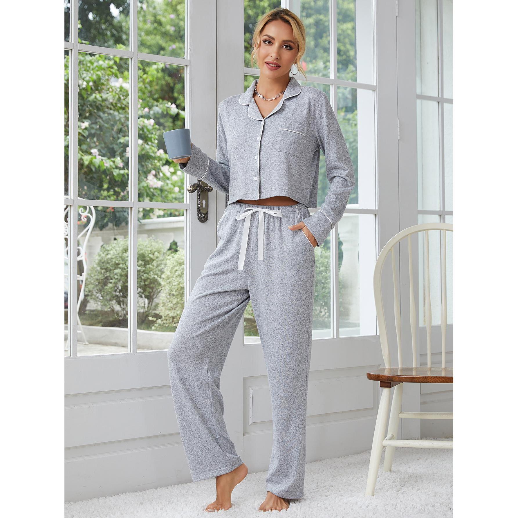 Woman wearing gray pajama set with white piping, perfect for home wear and lounge fashion