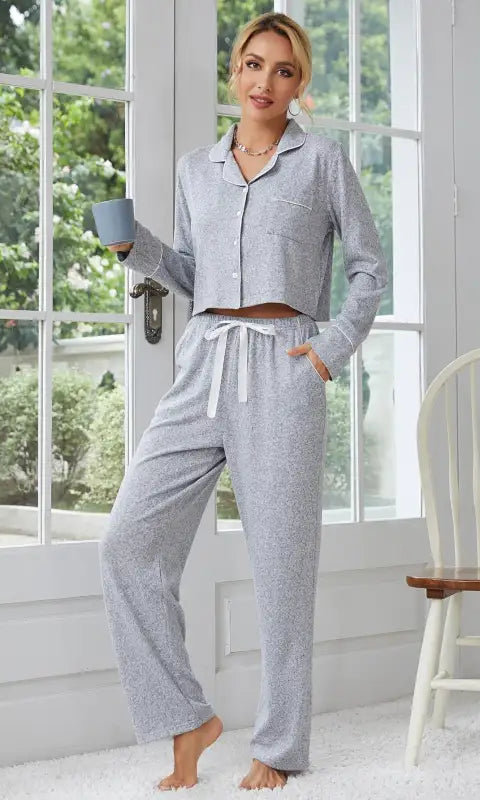 Gray two-piece langry home wear with white piping and drawstring waist