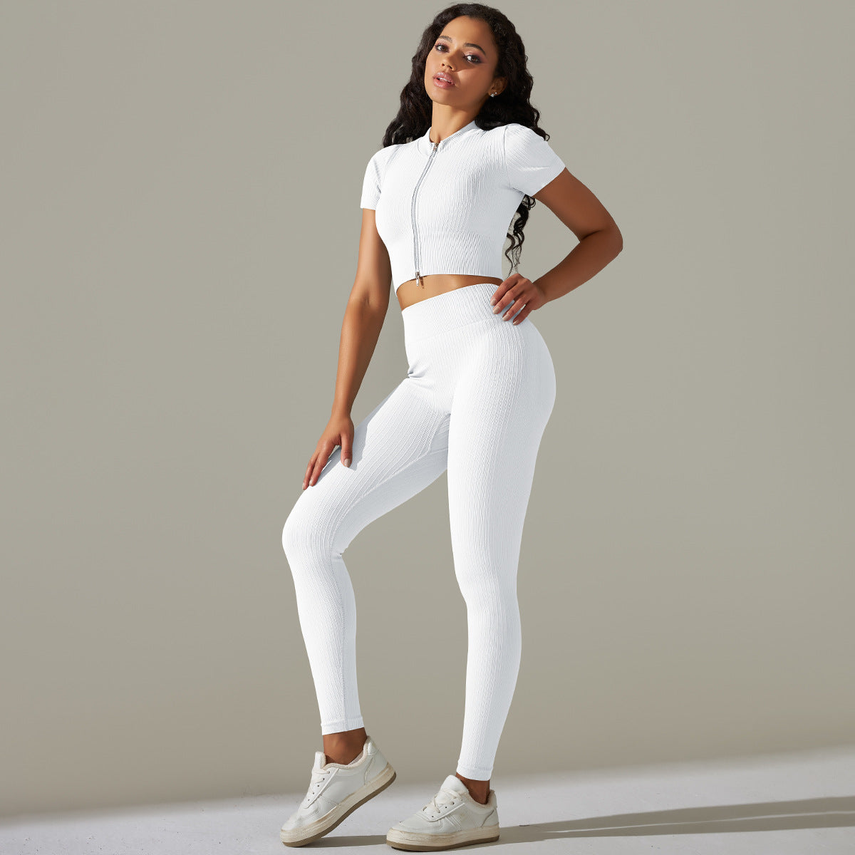 Woman in seamless knitted peach hip high waist yoga set showcasing athletic wear