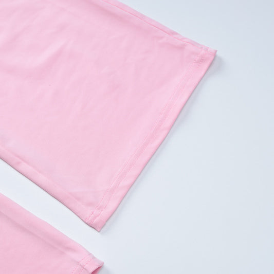 Pink fabric corners of the Slim Fit High Waist Suit highlighting high waist design