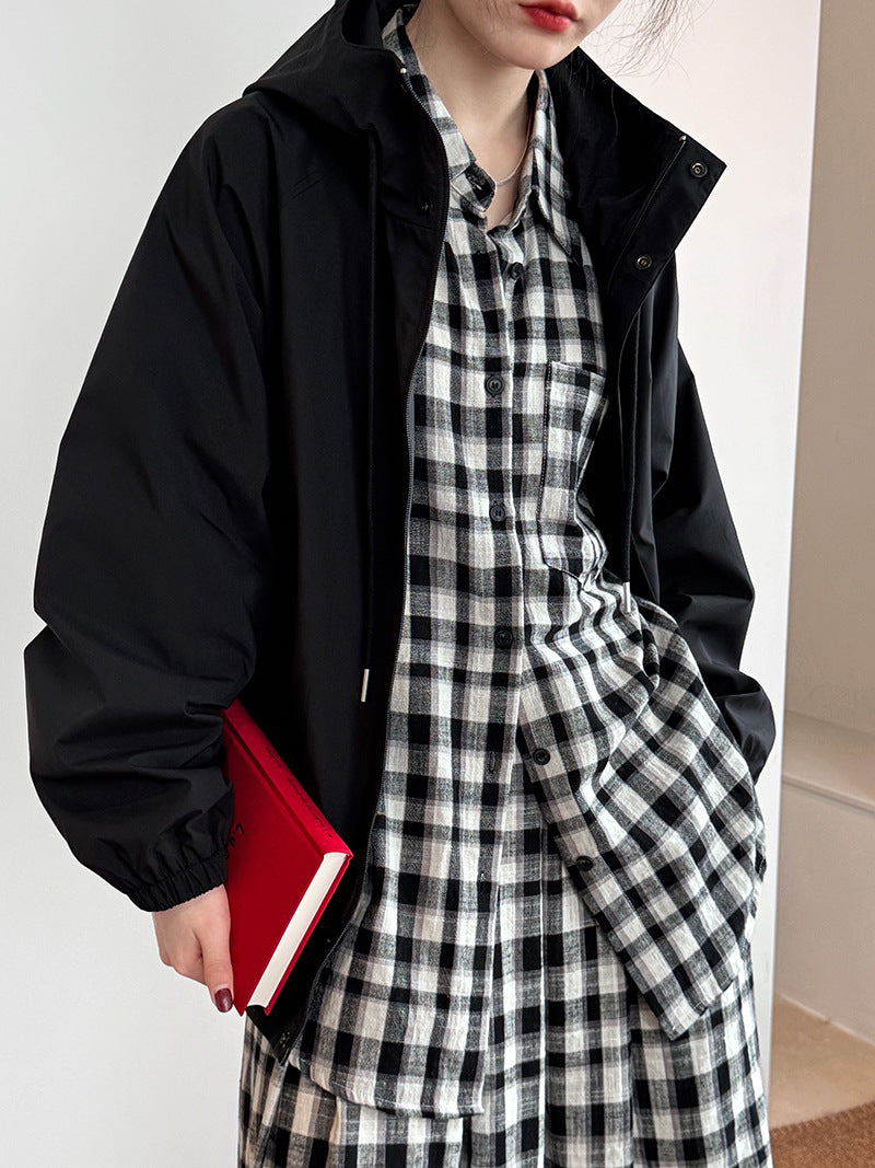 Black hooded jacket over plaid shirt dress displayed in Super Elegant Hooded Jacket for fashion and ملابس