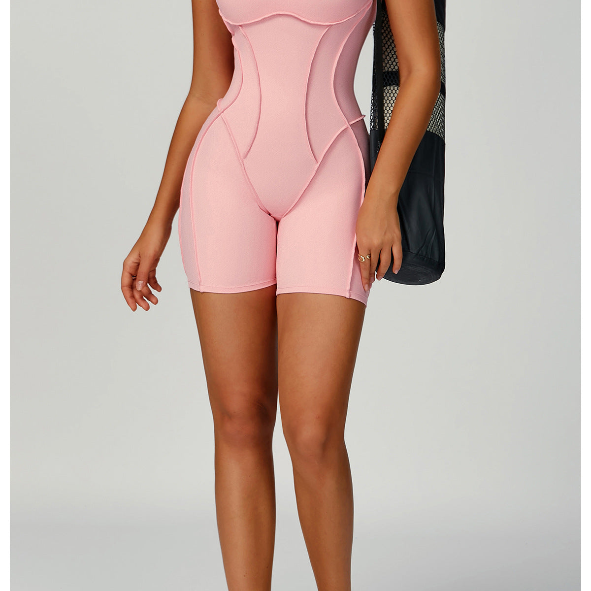 Pink Langry fashion yoga jumpsuit with cutout bodysuit and white sneakers