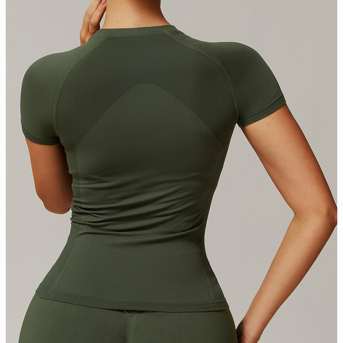 Olive green athletic top from Thread Seamless Short Sleeved T-shirt Yoga for stylish fitness ملابس