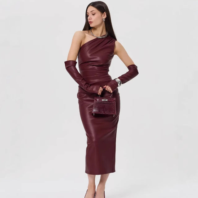Burgundy leather one-shoulder dress with gloves and handbag, ideal for elegant fashion ملابس