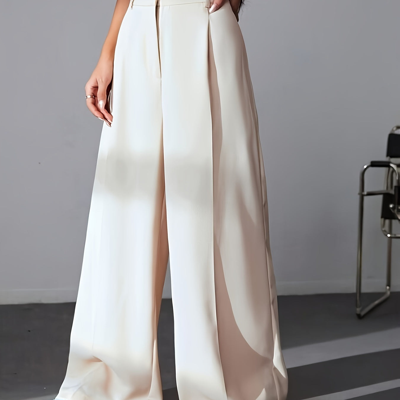 Cream-colored wide leg palazzo pants with pleated front detailing for women’s fashion