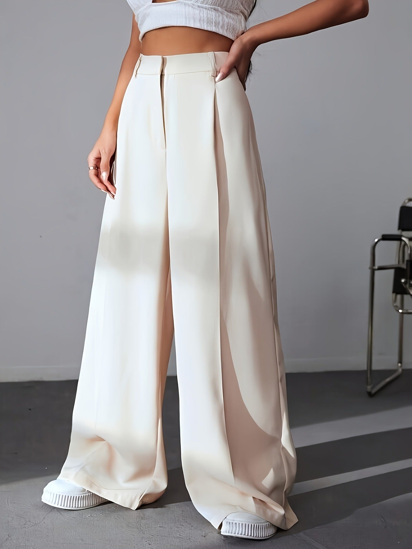 Cream-colored wide leg palazzo pants with pleated front detailing for women’s fashion