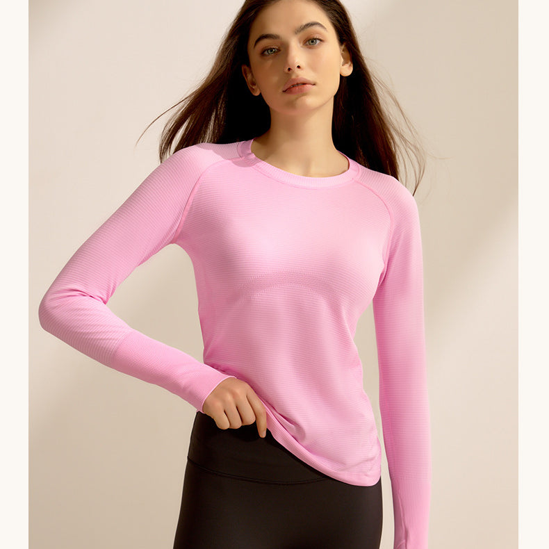 Pink long-sleeved crewneck sweater and black leggings, stylish langry fitness outfit