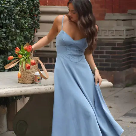 Light blue sleeveless langry midi dress with fitted bodice and flowing skirt
