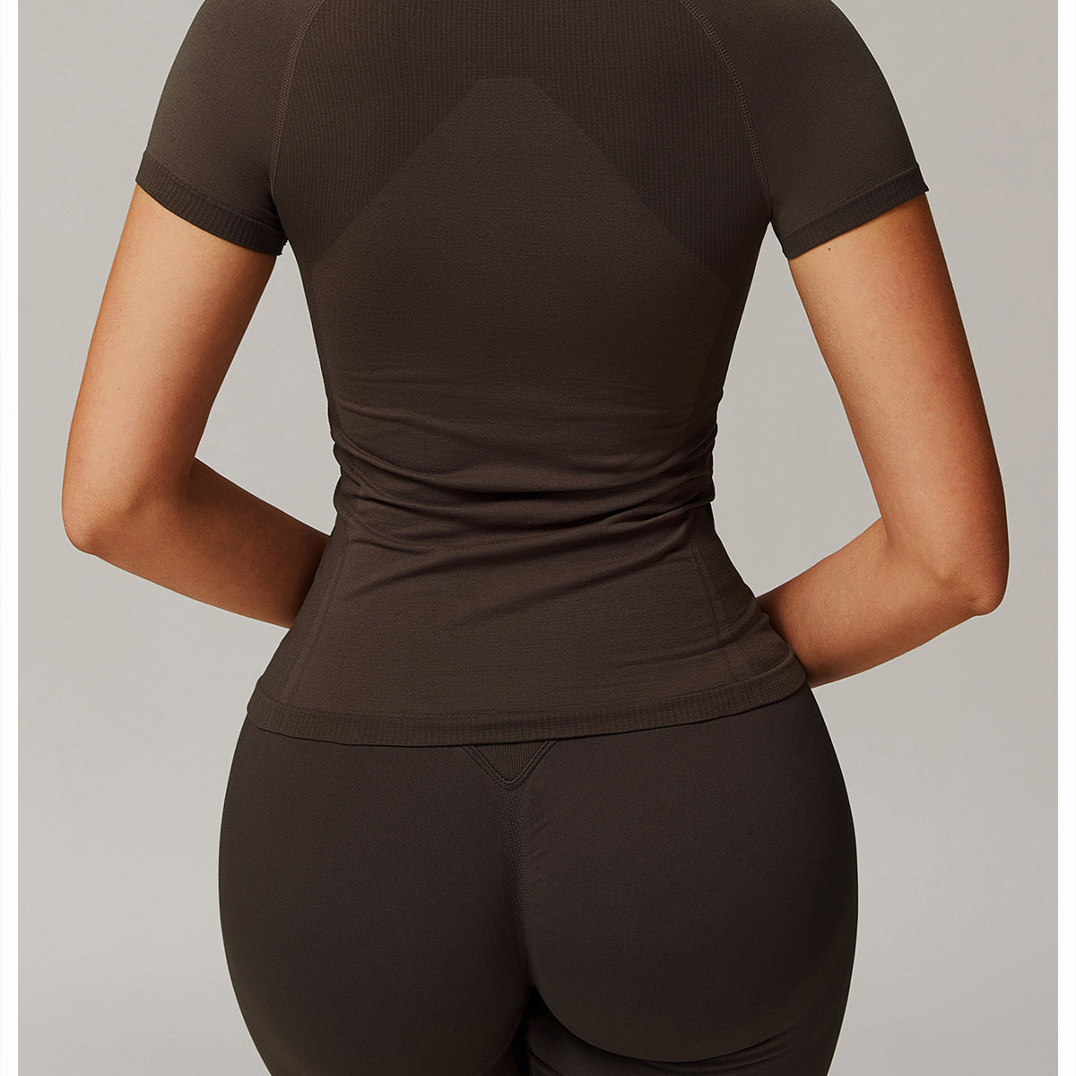 Dark brown athletic set featuring Thread Seamless Short Sleeved T Shirt for yoga fashion