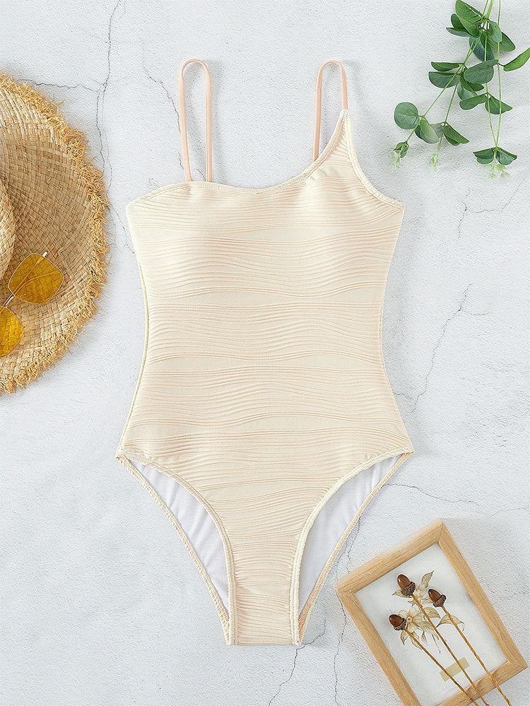 Beige one-piece swimsuit with solid color push-up design, ideal for women