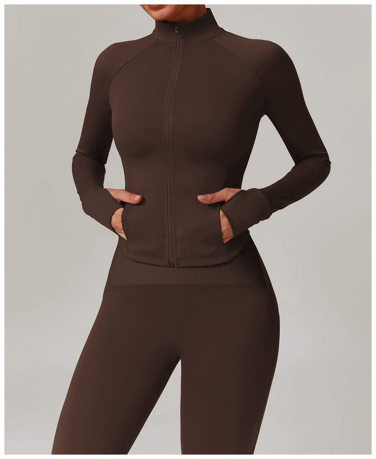 Brown athletic zip-up jumpsuit, ideal for yoga, featuring a fitted design and long sleeves
