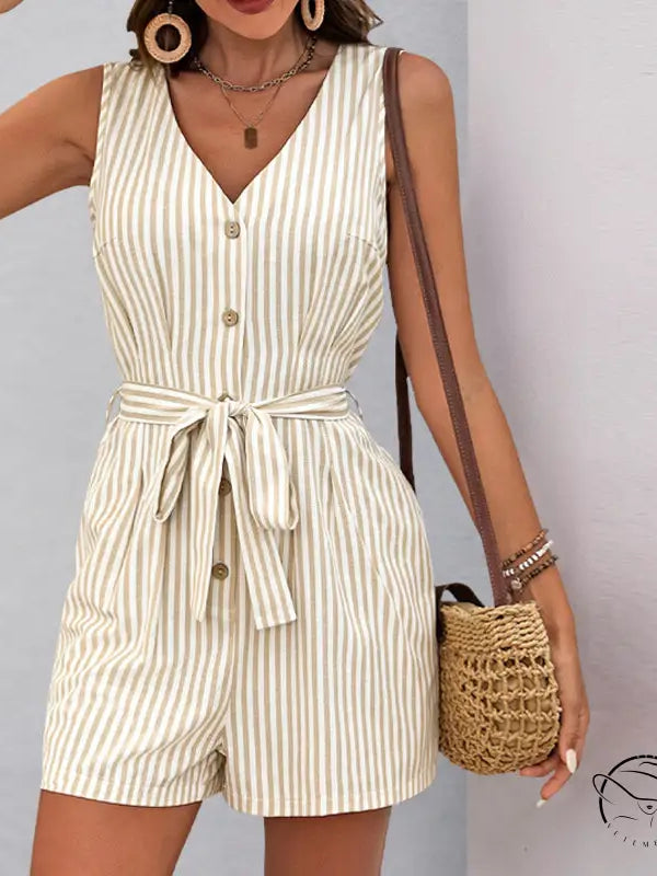 Beautiful summer jumpsuit: sleeveless beige and white striped romper with button front and waist tie