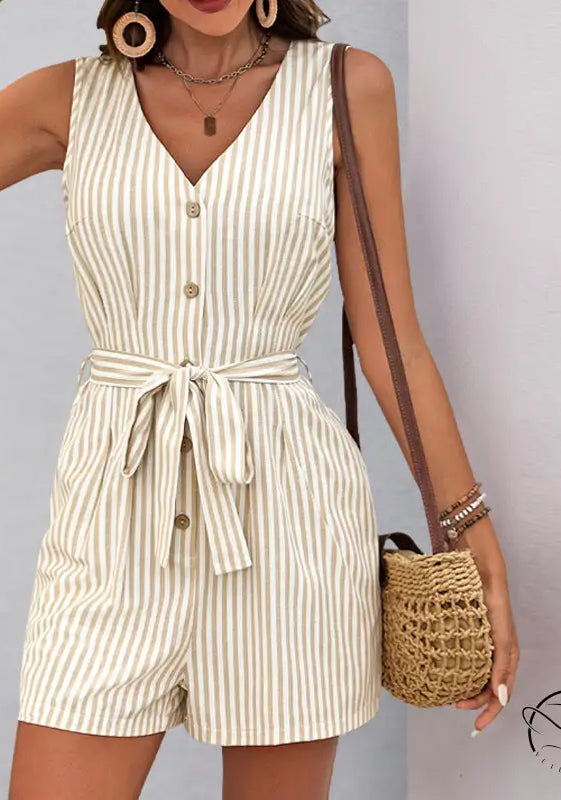 Beautiful summer jumpsuit: sleeveless beige and white striped romper with button front and waist tie