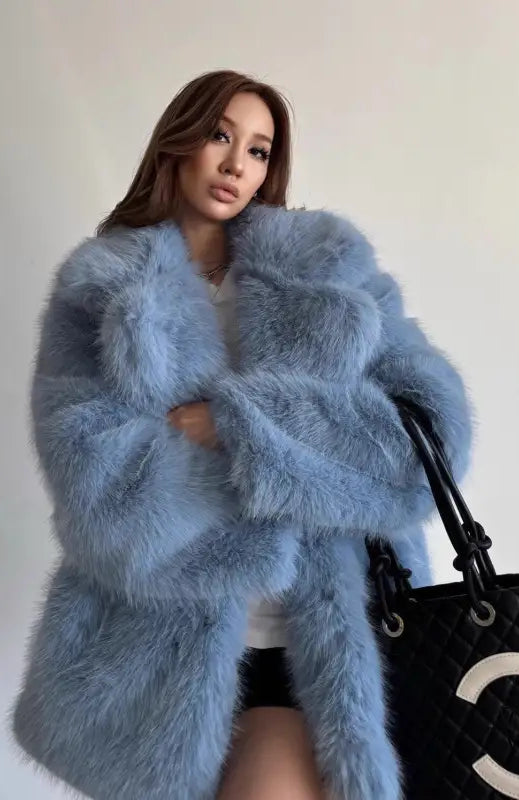 Light blue faux fur coat with Chanel logo tote bag