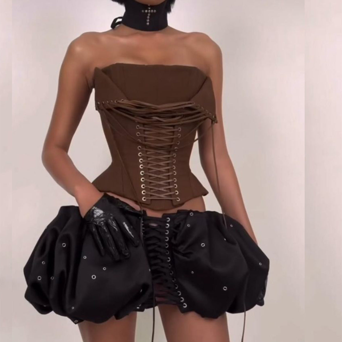 Elegant advanced design boning corset in brown leather with black ruffled skirt and gloves