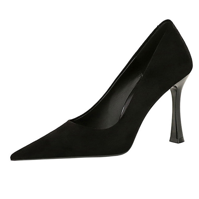 Black suede pointed-toe pump with slim heel, perfect for elegant fashion ensembles