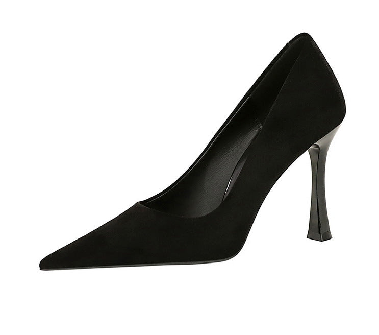 Black suede pointed-toe pump with slim heel, perfect for elegant fashion ensembles