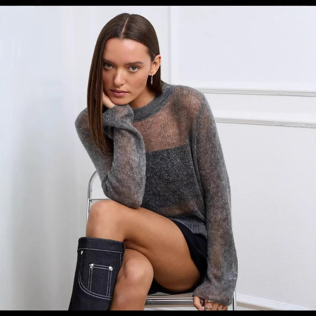 Grey mohair sweater with sheer panels, styled with black shorts and knee-high boots in fashion
