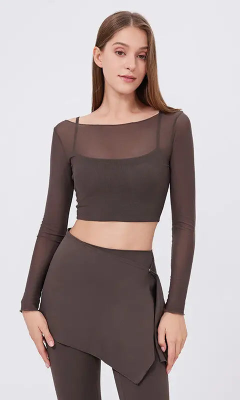 Sleek faux two piece mesh sports long sleeve cropped top with asymmetrical hem