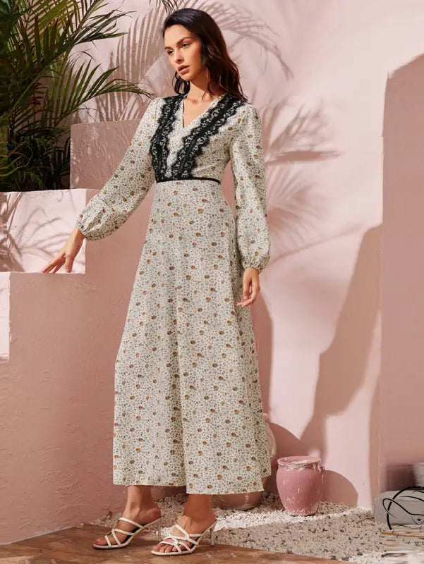 Woman in cute stitching lace high waist langry fashion dress with floral pattern