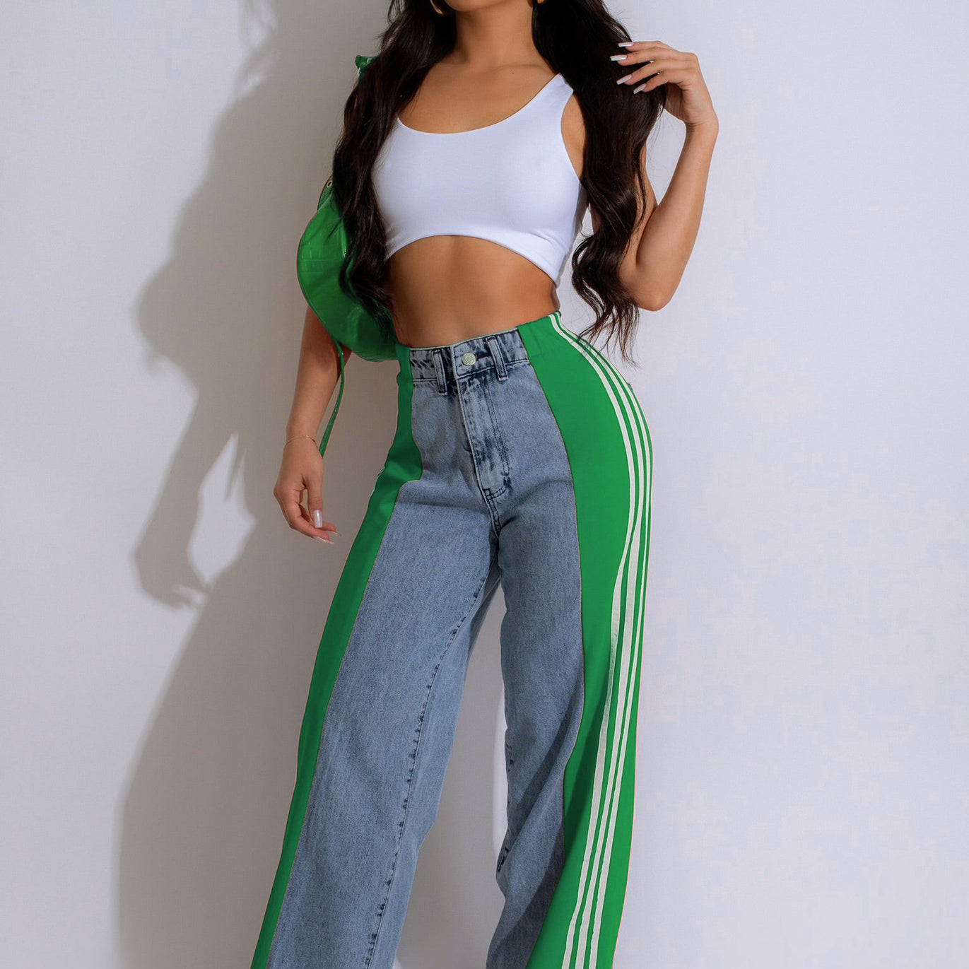 Customized denim jeans with green side panels and a white crop top for stylish casual wear