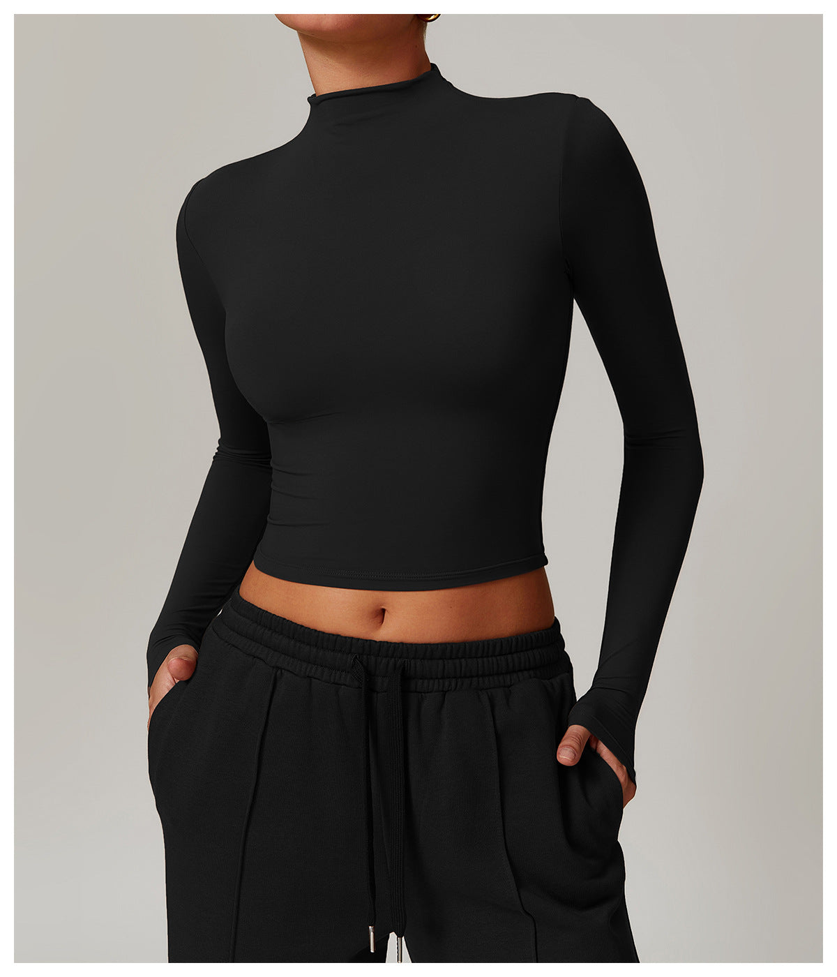 Black long-sleeved crop top with mock turtleneck for stylish langry fitness wear