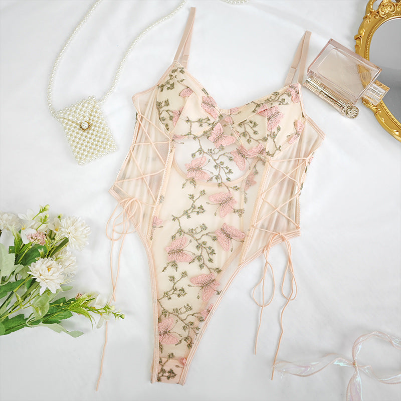 Floral embroidered peach lingerie bodysuit with side lace-up, perfect for elegant fashion