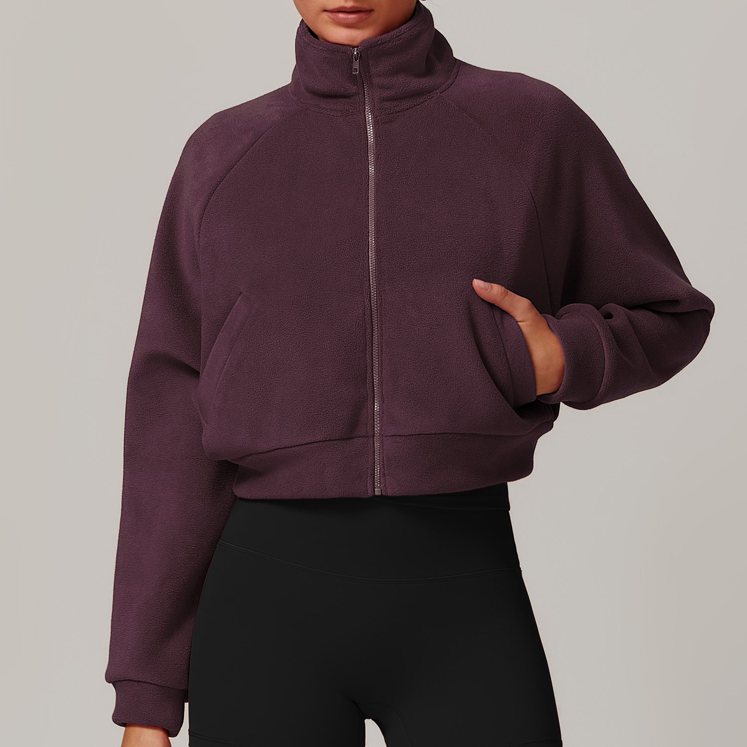 Cropped burgundy zip-up sweatshirt for fitness, styled with black leggings. ملابس fashion