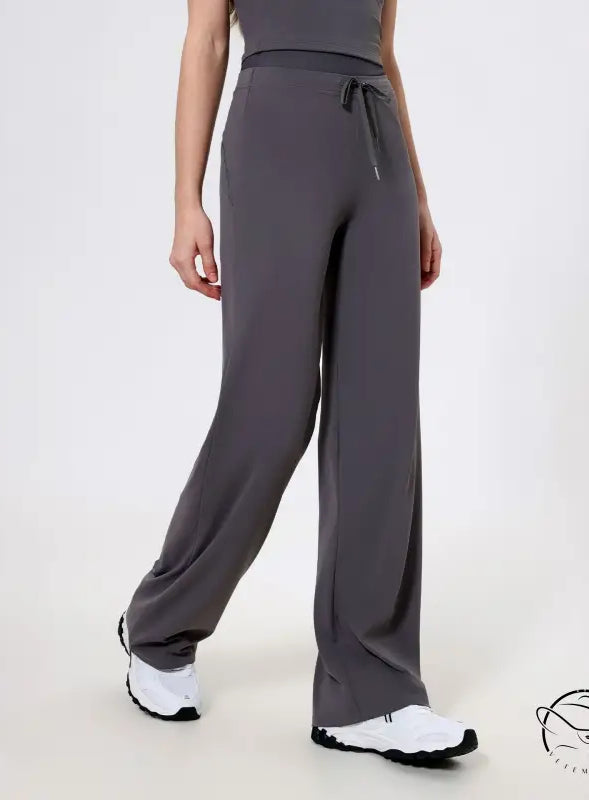 Gray langry wide-leg quick-drying athletic pants with drawstring waist and white sneakers