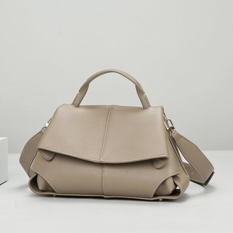 Langry beige leather fashion handbag with structured design and adjustable strap