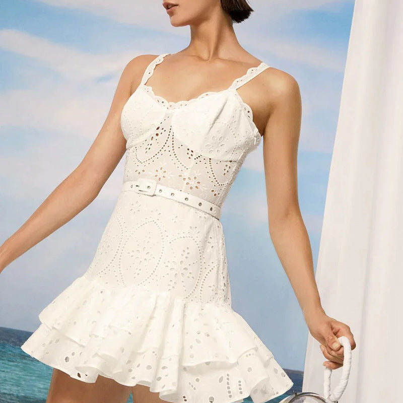 White eyelet lace sundress featuring spaghetti straps and ruffled hem for stylish summer fashion