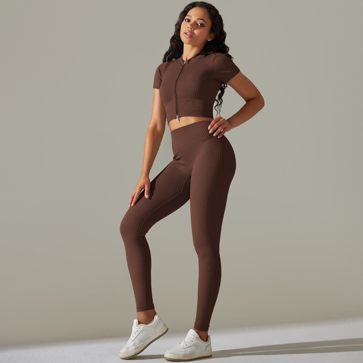 Seamless knitted peach athletic set featuring brown ribbed fabric and peach hip high design