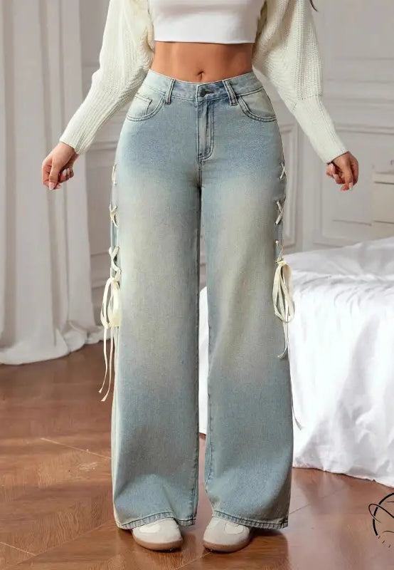Casual wide leg jeans in light-wash denim with cream lace-up side ties