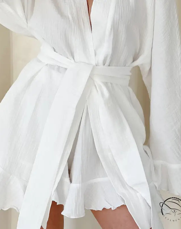 White ruffled mini wrap dress in loose shorts ruffled pajamas style