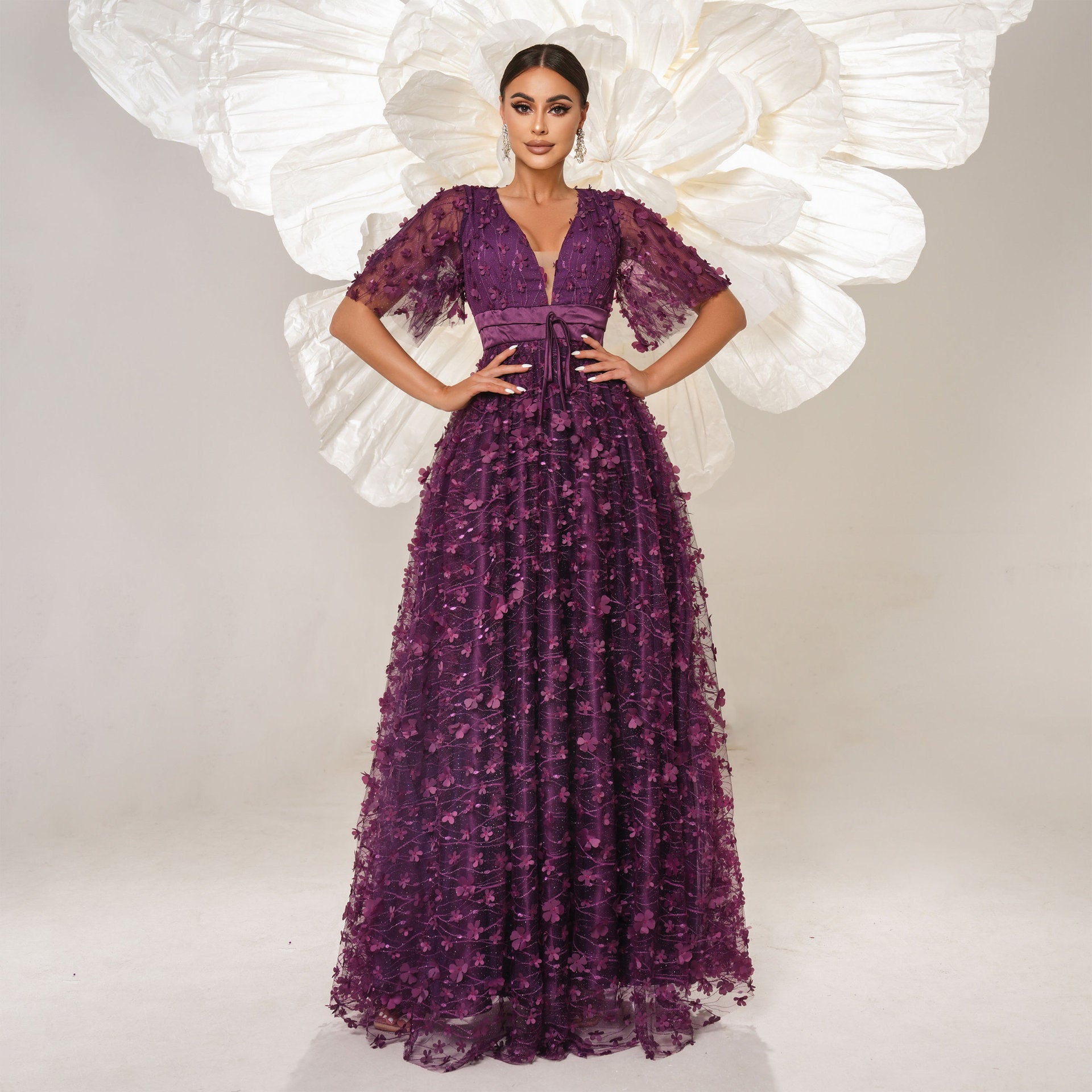 Elegant purple floral gown showcasing high-end fashion and ملابس for women’s evening events