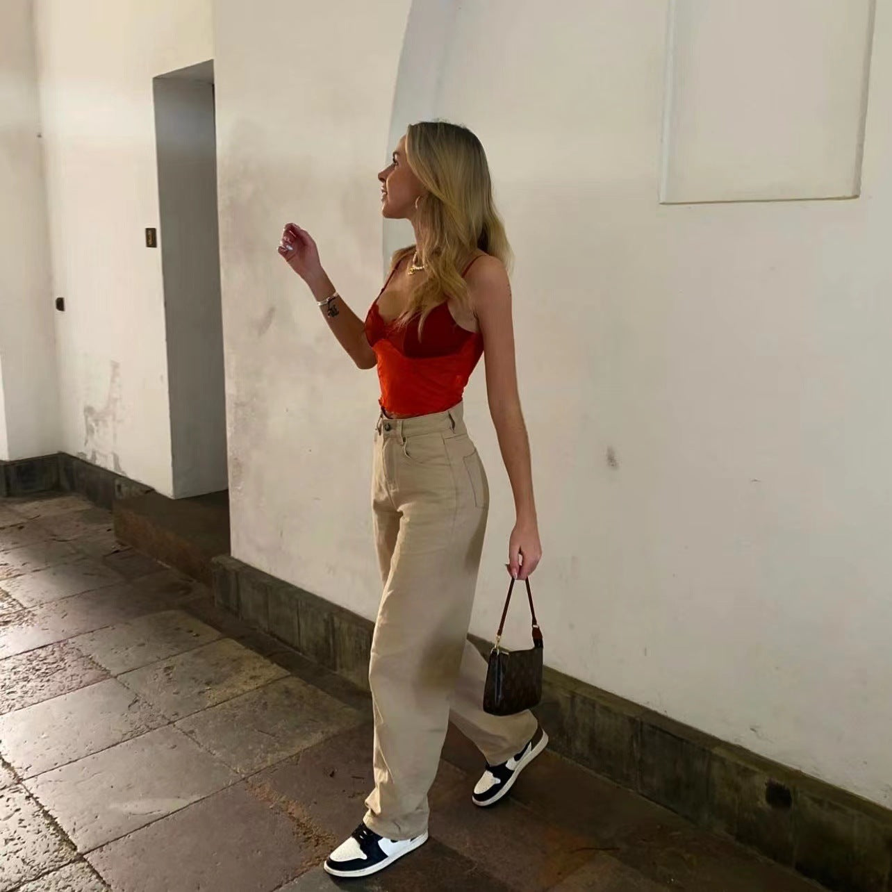 Woman in red top and beige Retro Light Khaki High Waist Draggle Tail Trousers showcasing street smart fashion