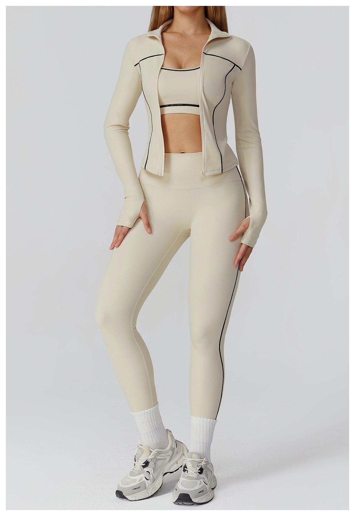 Langry beige zip-up windproof jacket with black piping and white sneakers