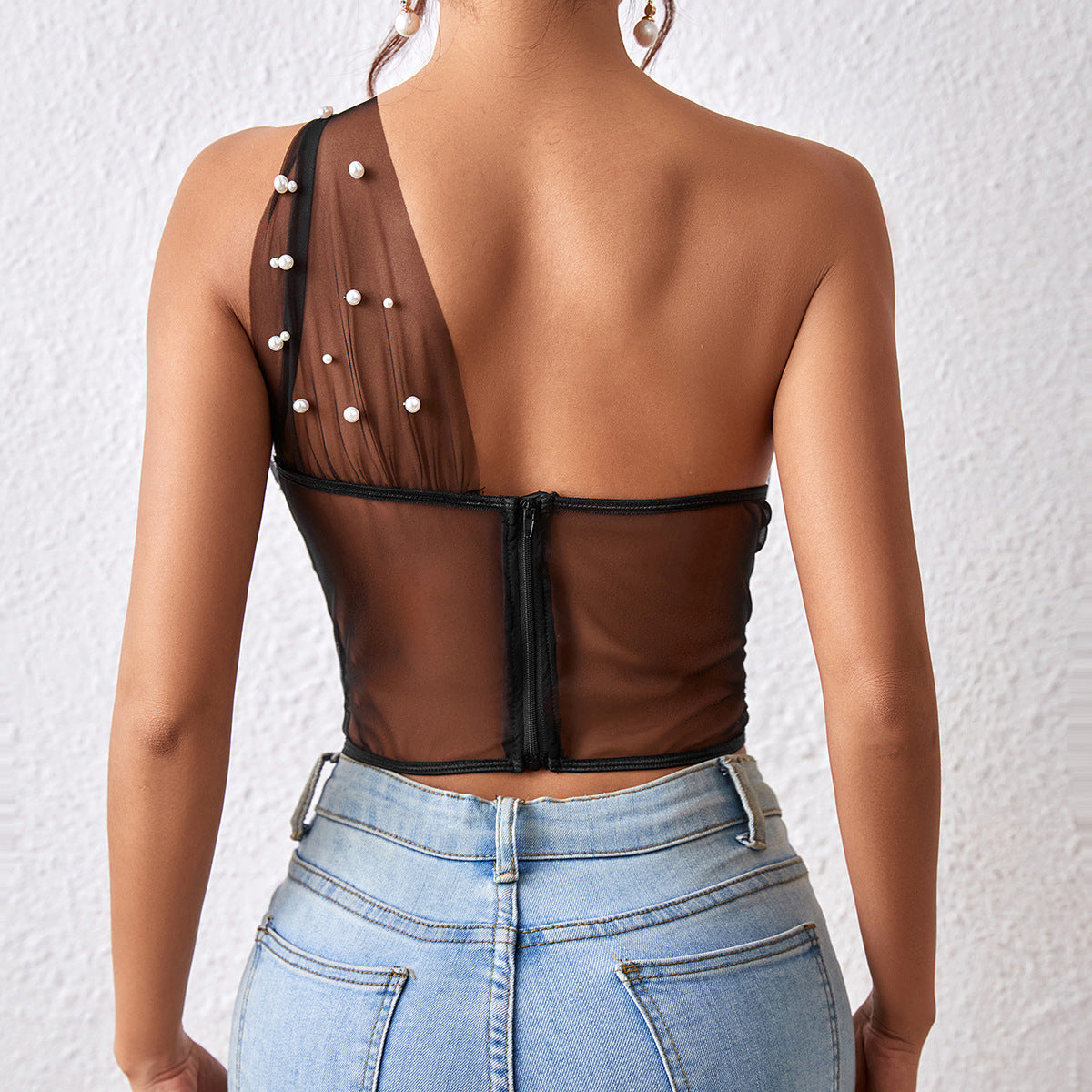 Sheer mesh one-shoulder top with pearl embellishments and steel ring boning details