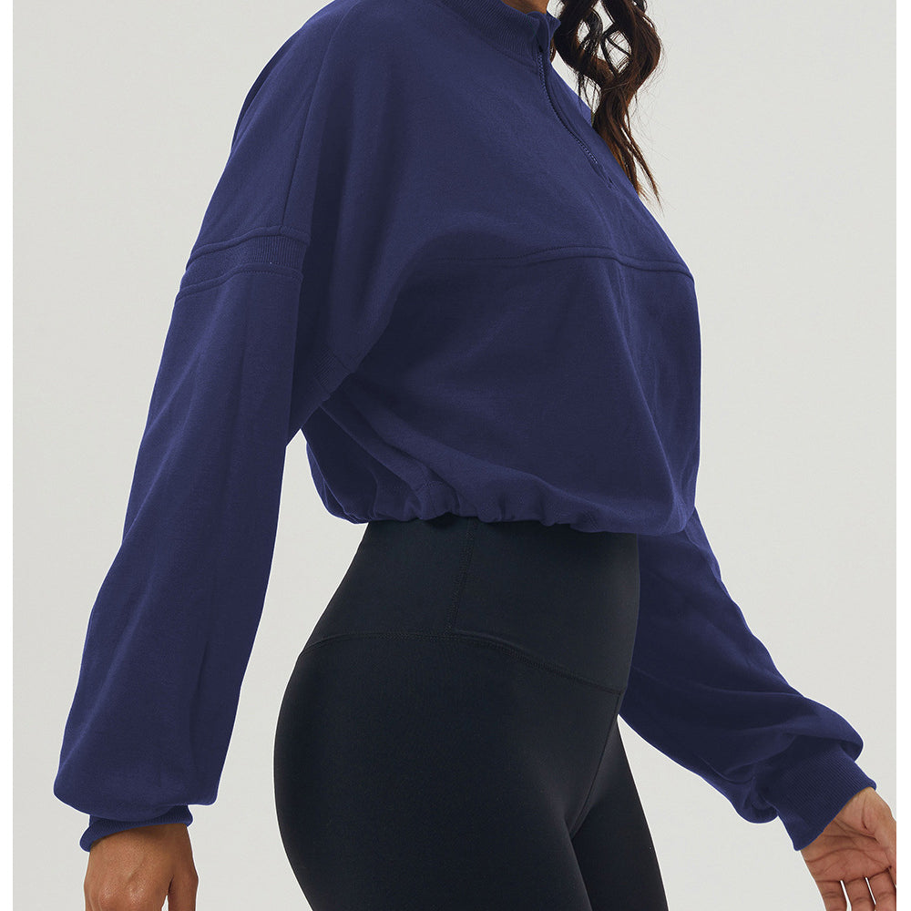 Navy cropped long sleeve sweatshirt paired with black biker shorts for casual fashion