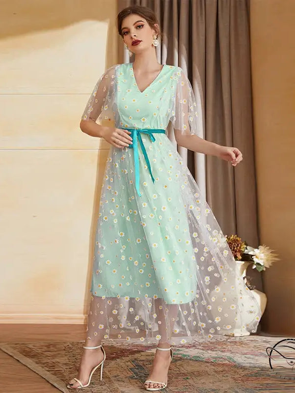 Enchanting high waist A-line fairy dress in mint green with daisy embroidery