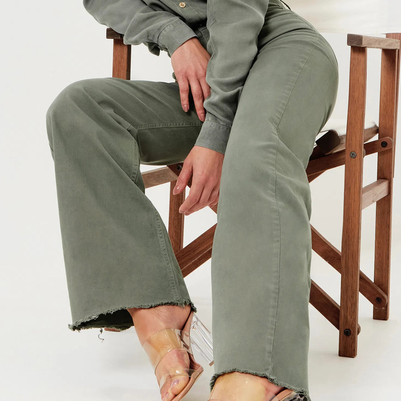 Olive green denim jumpsuit with clear heels in women’s fashion ملابس for a stylish look